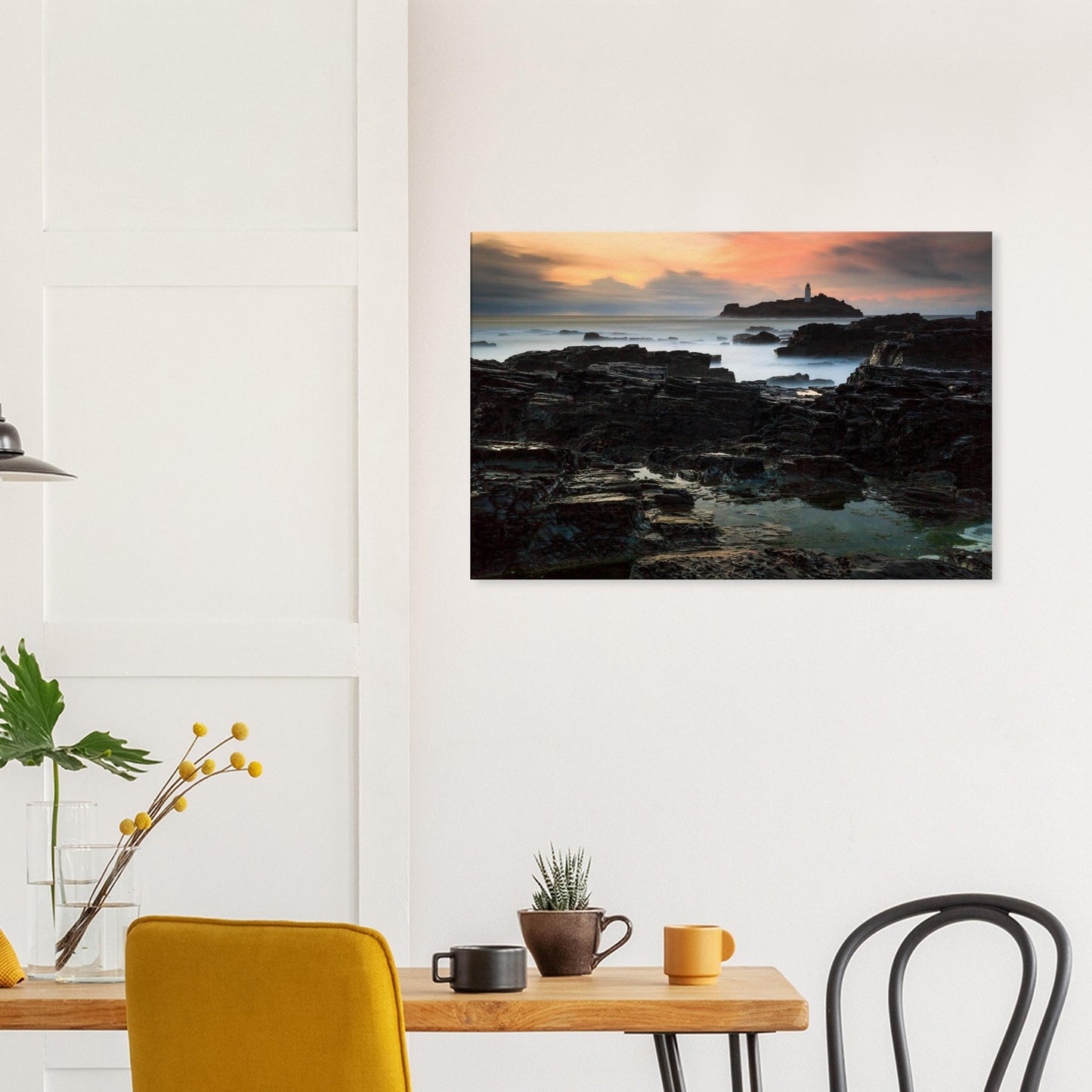 Canvas print of Cornish lighthouse at dusk with interplay of golden light and rugged terrain.