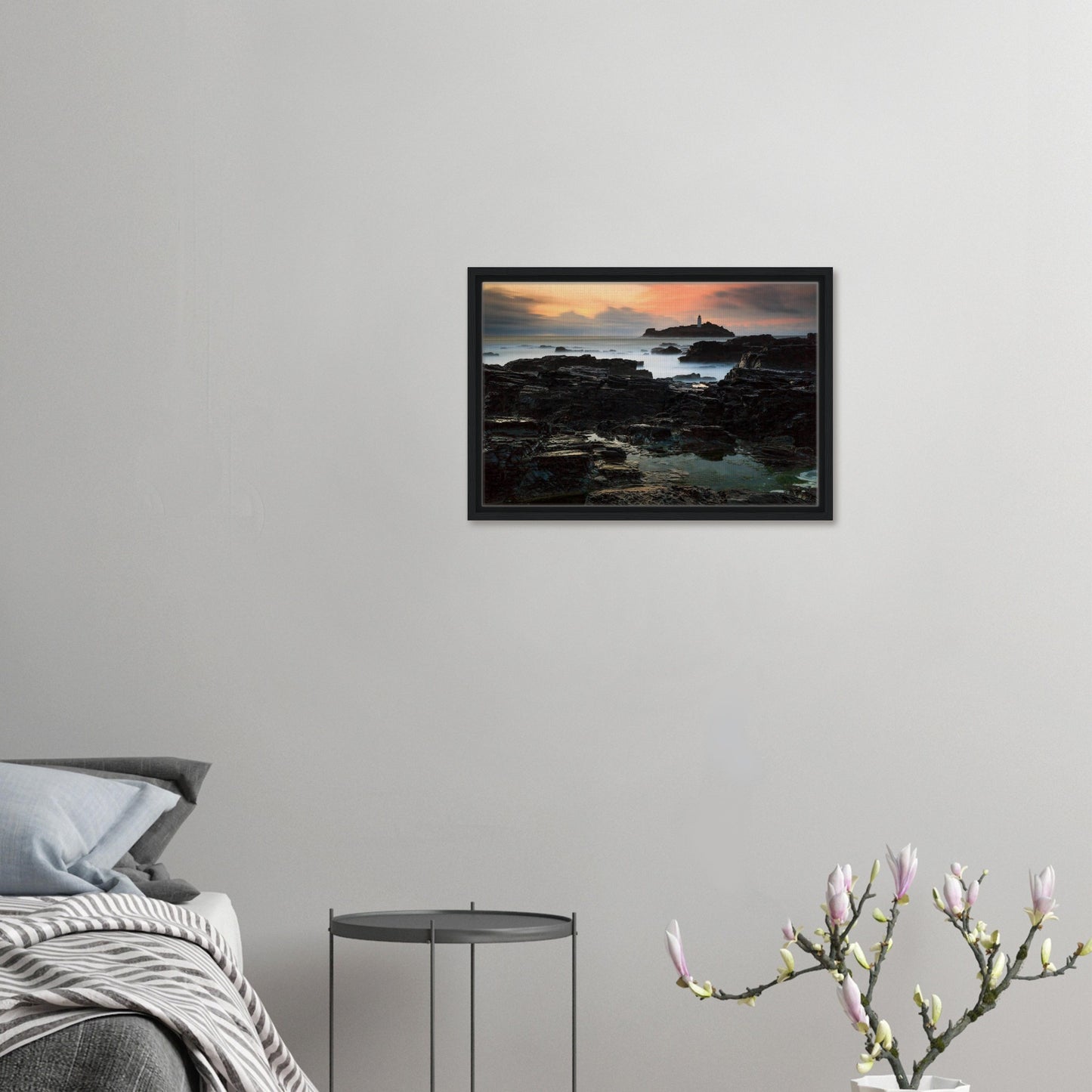 Framed wall art of Godrevy Lighthouse with warm evening sky