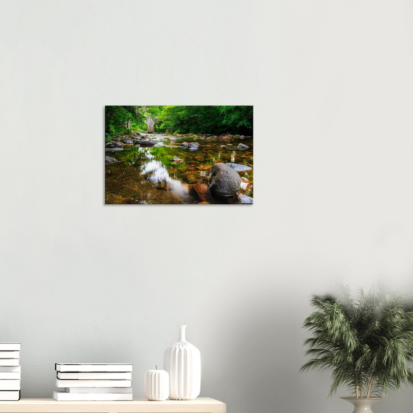 Quiet riverscape of Newbridge with delicate ripples and tranquil, clear water reflections