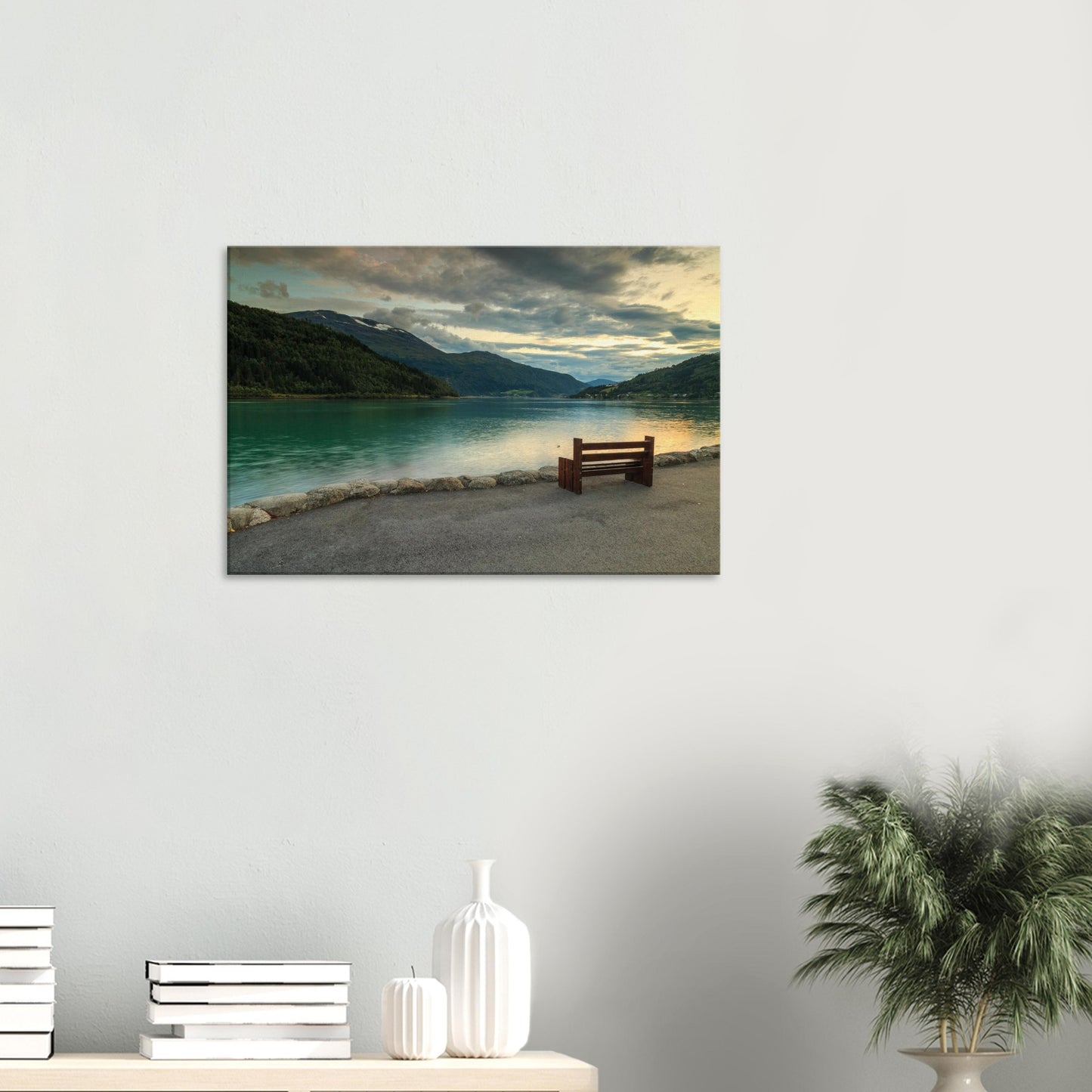 Soothing natural vista of Norwegian fjord calm waters framed by softly lit hills at twilight
