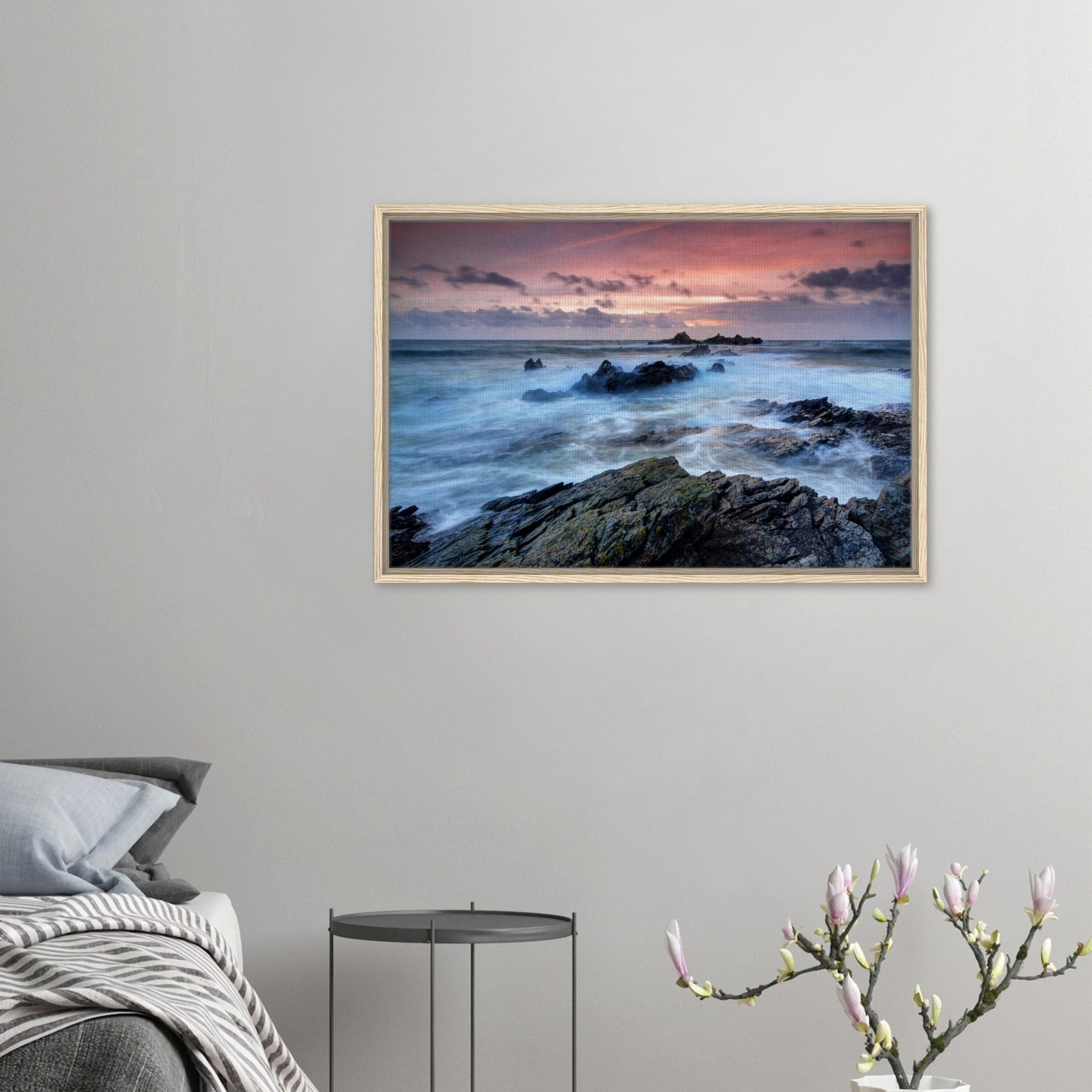 Sunset seascape of Heybrook Bay with frothy waves in frame