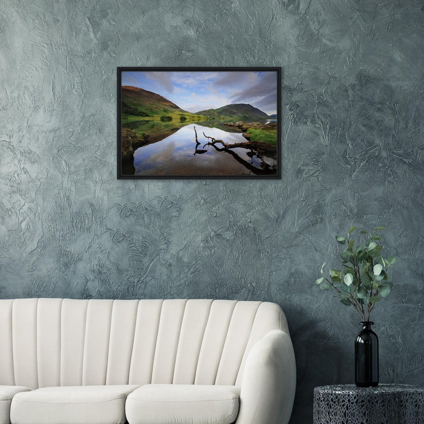 Calm and contemplative scene of Crummock Water with branch