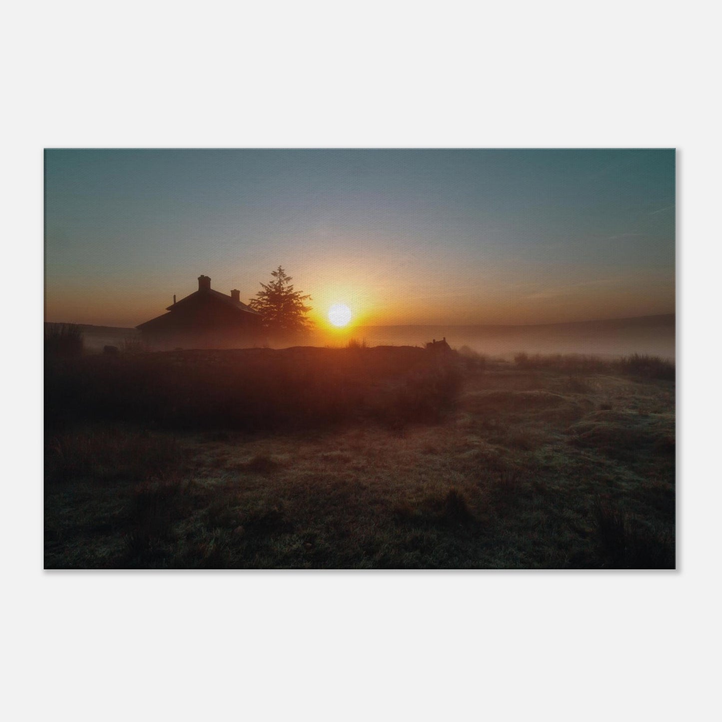 Canvas Print of Dartmoor’s Nun’s Cross Farm bathed in warm sunrise light