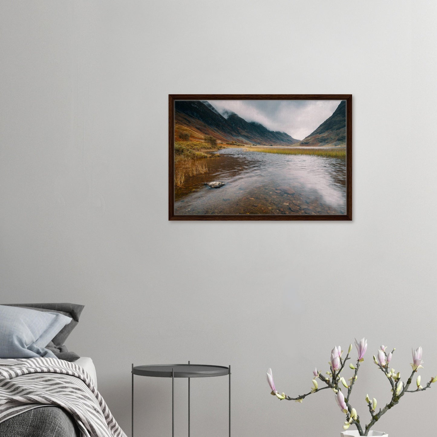 Tranquil Glencoe loch with misty peaks