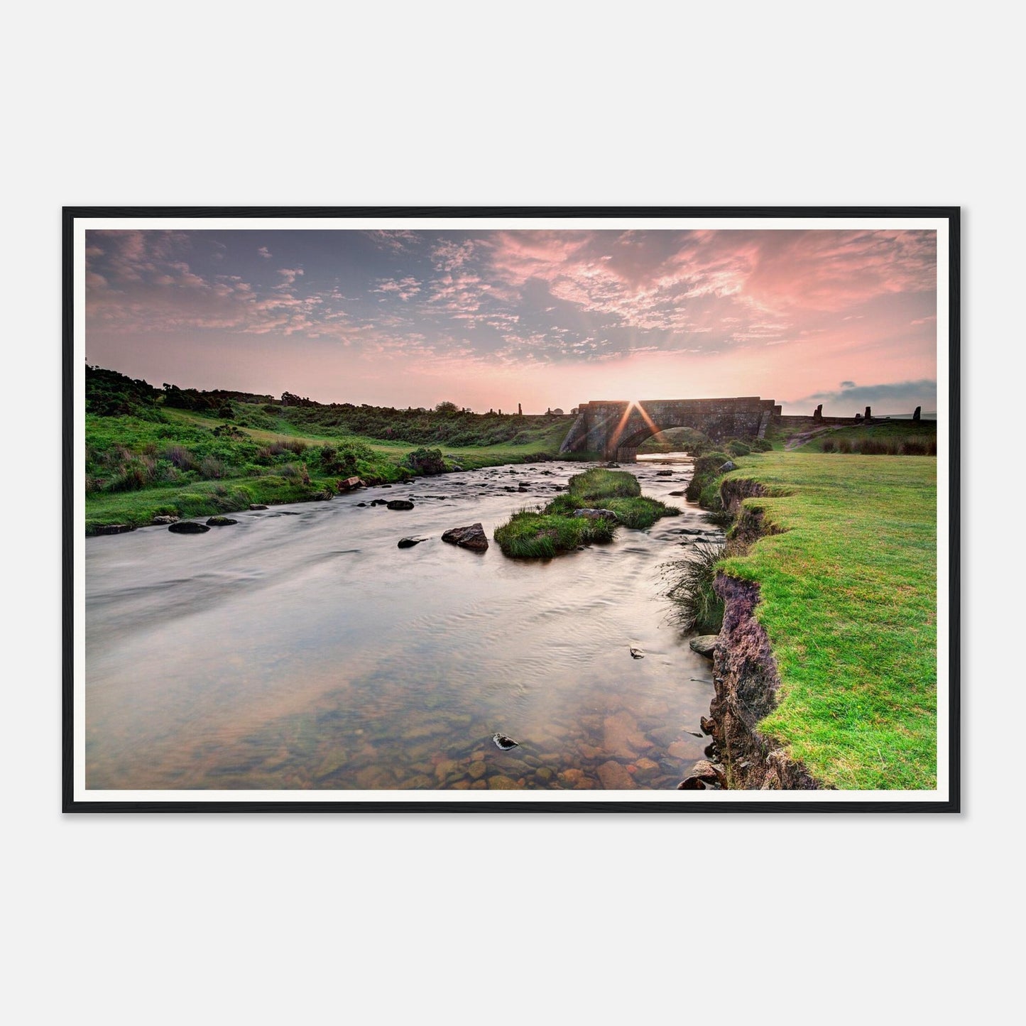 Tranquil Dartmoor dawn scene with river and ancient bridge