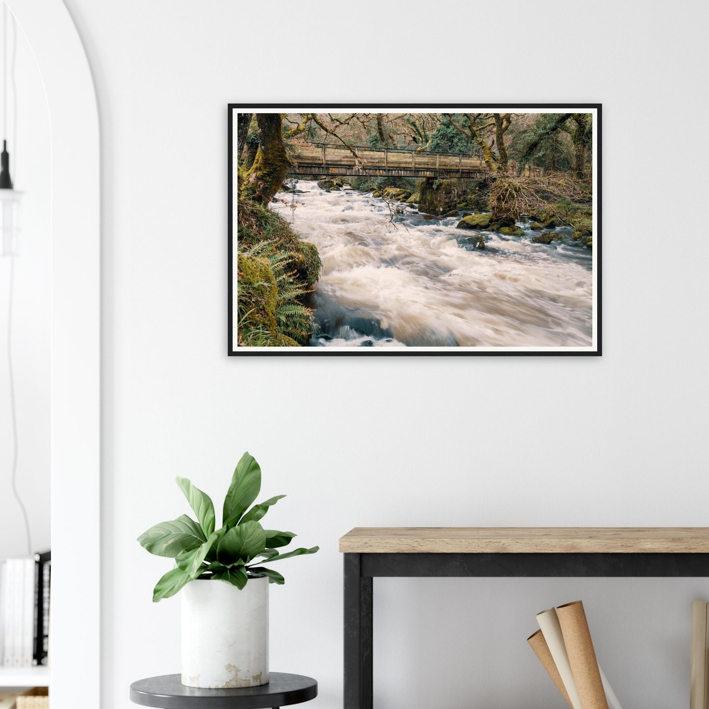 Framed print of River Plym in motion beneath wooden bridge