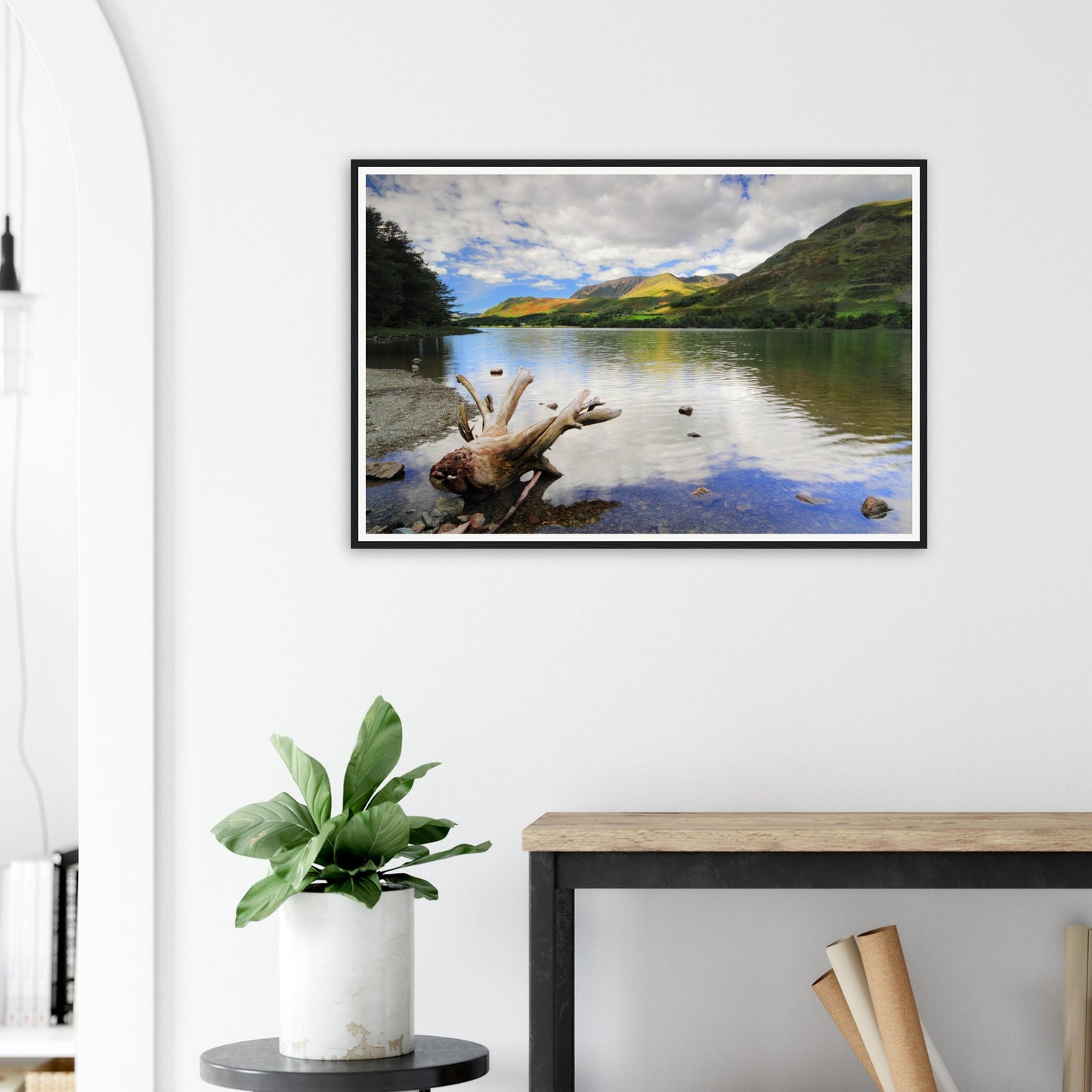 Peaceful Buttermere Lake scene with sculpted driftwood in front