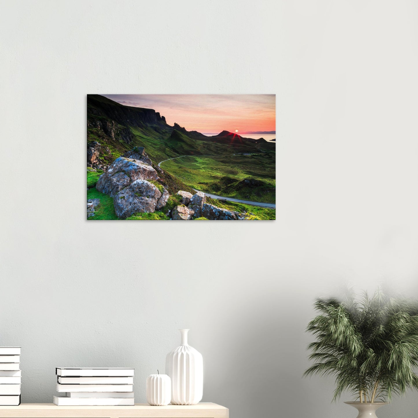 Sunset canvas print of The Quiraing showcasing rugged terrain softened by green grass and a fiery sky on Skye.