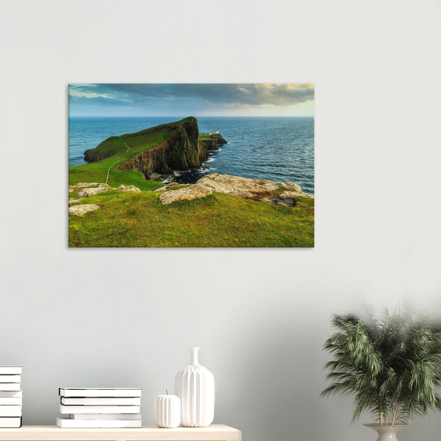 Canvas print of Neist Point on the Isle of Skye featuring cliffs, green hills, and a distant lighthouse.