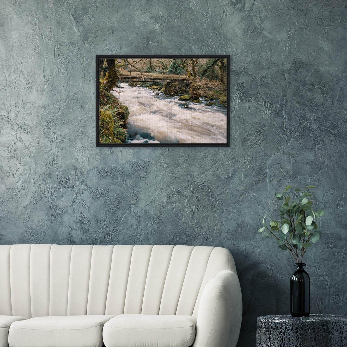 Scenic Dartmoor river framed by trees and wooden bridge