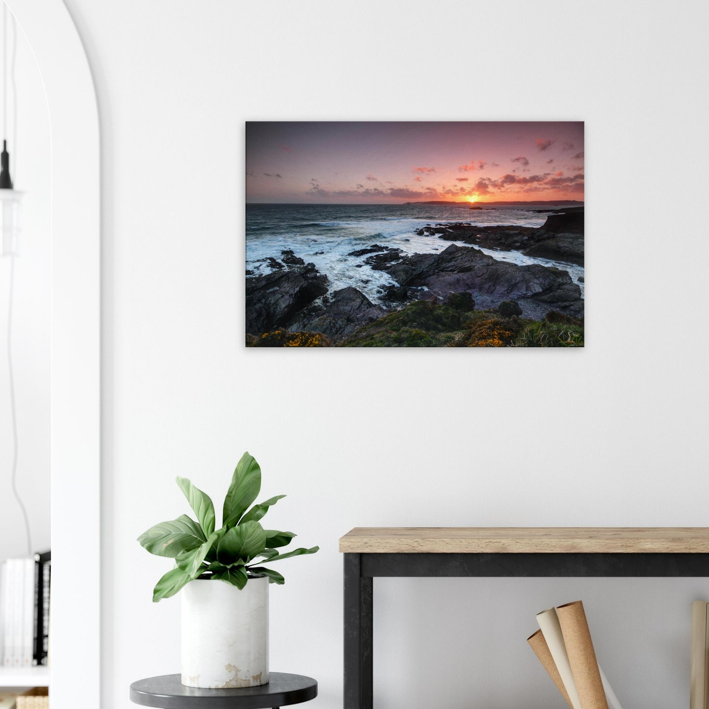 Peaceful evening canvas print of Heybrook Bay in Plymouth showing warm sunset light, rugged coastline, and cliffside wildflowers.