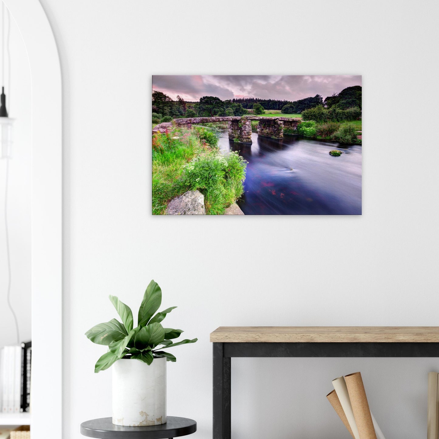 Devon countryside bridge with flowing water and flowers