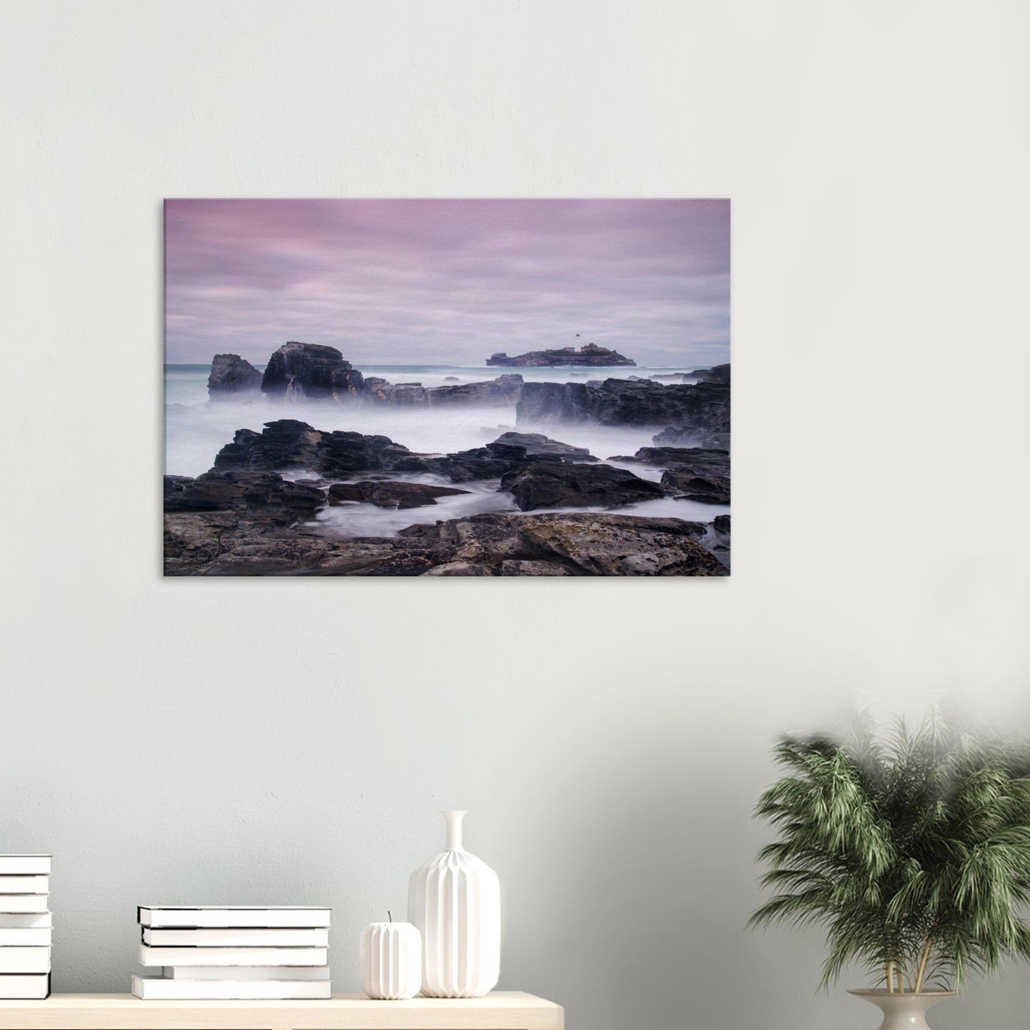 Coastal wall art of Godrevy Lighthouse in Cornwall with mist-veiled sea, sharp rocks, and a soft evening sky.