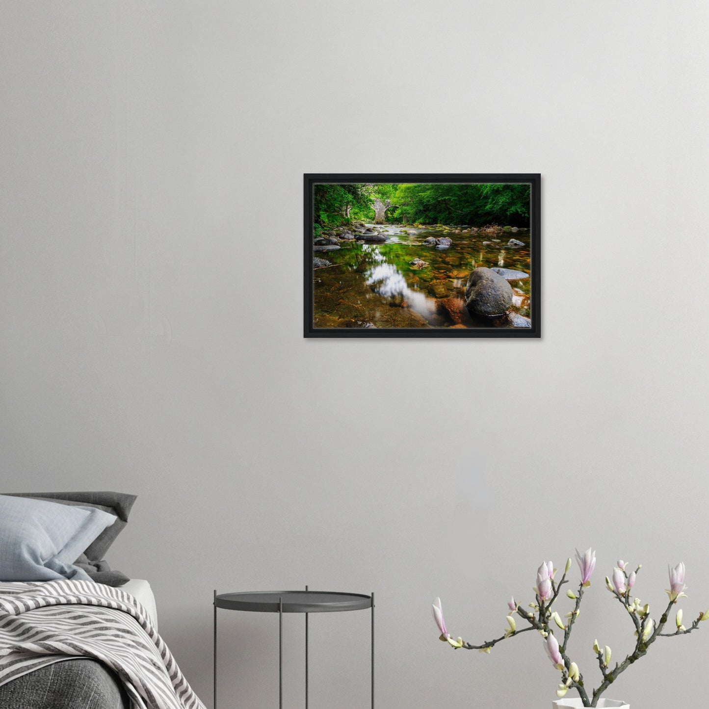 Clear flowing river under stone bridge in framed artwork