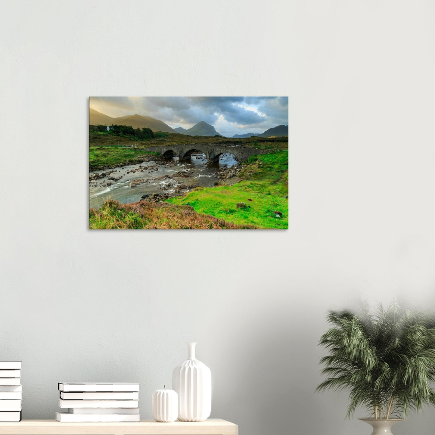 Sligachan Old Bridge canvas featuring arches over a flowing river, framed by heather and misty Scottish hills.