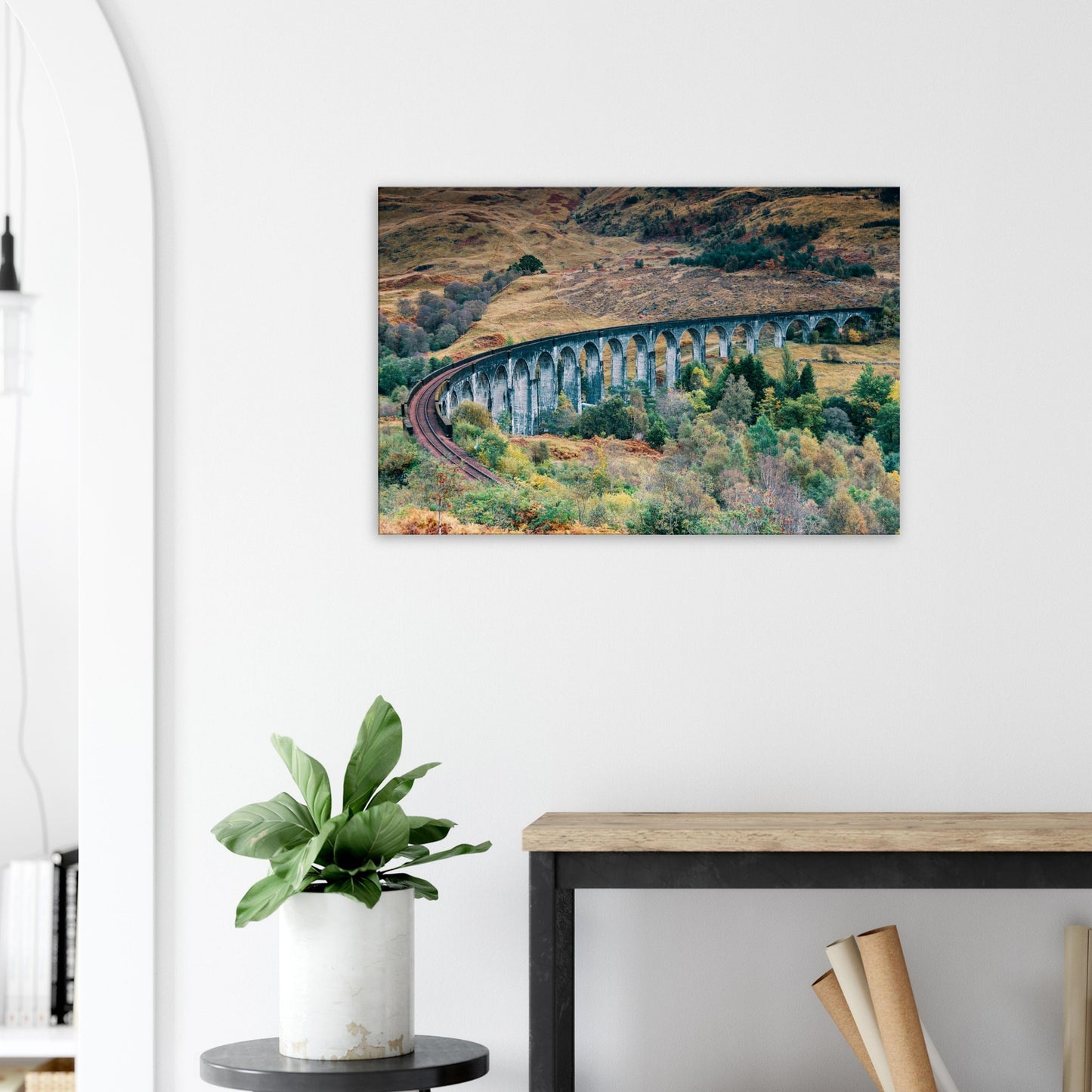 Famous Glenfinnan Viaduct framed by wild Scottish hills