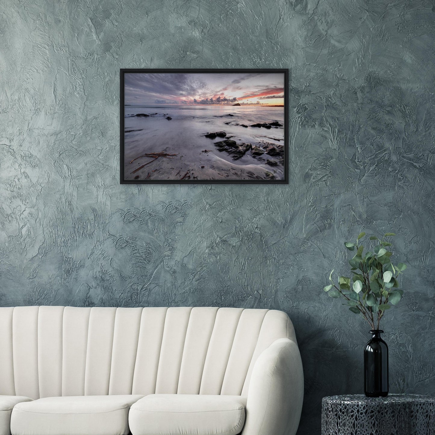 Wembury Beach shoreline with driftwood and warm sky in print