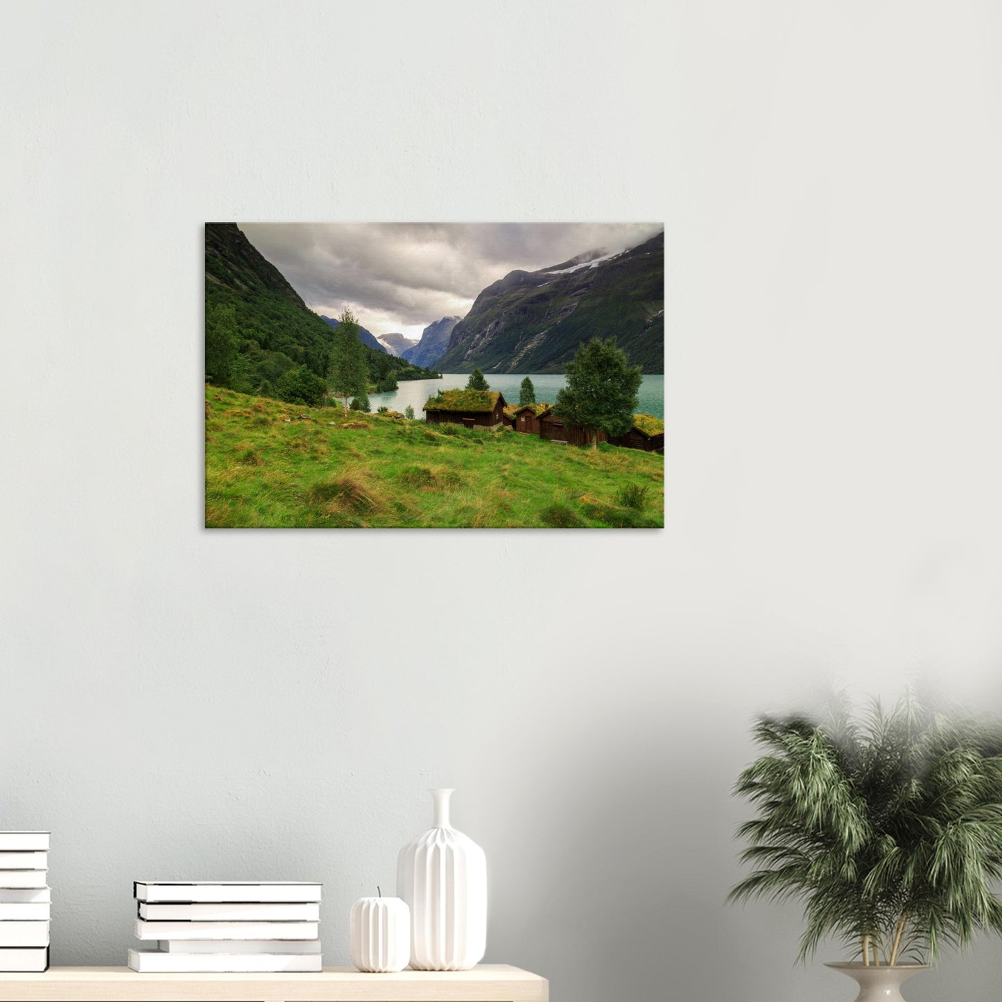 Canvas wall art illustrating Lodalen Valley’s serene lake and traditional cabins surrounded by verdant forests and steep mountains.