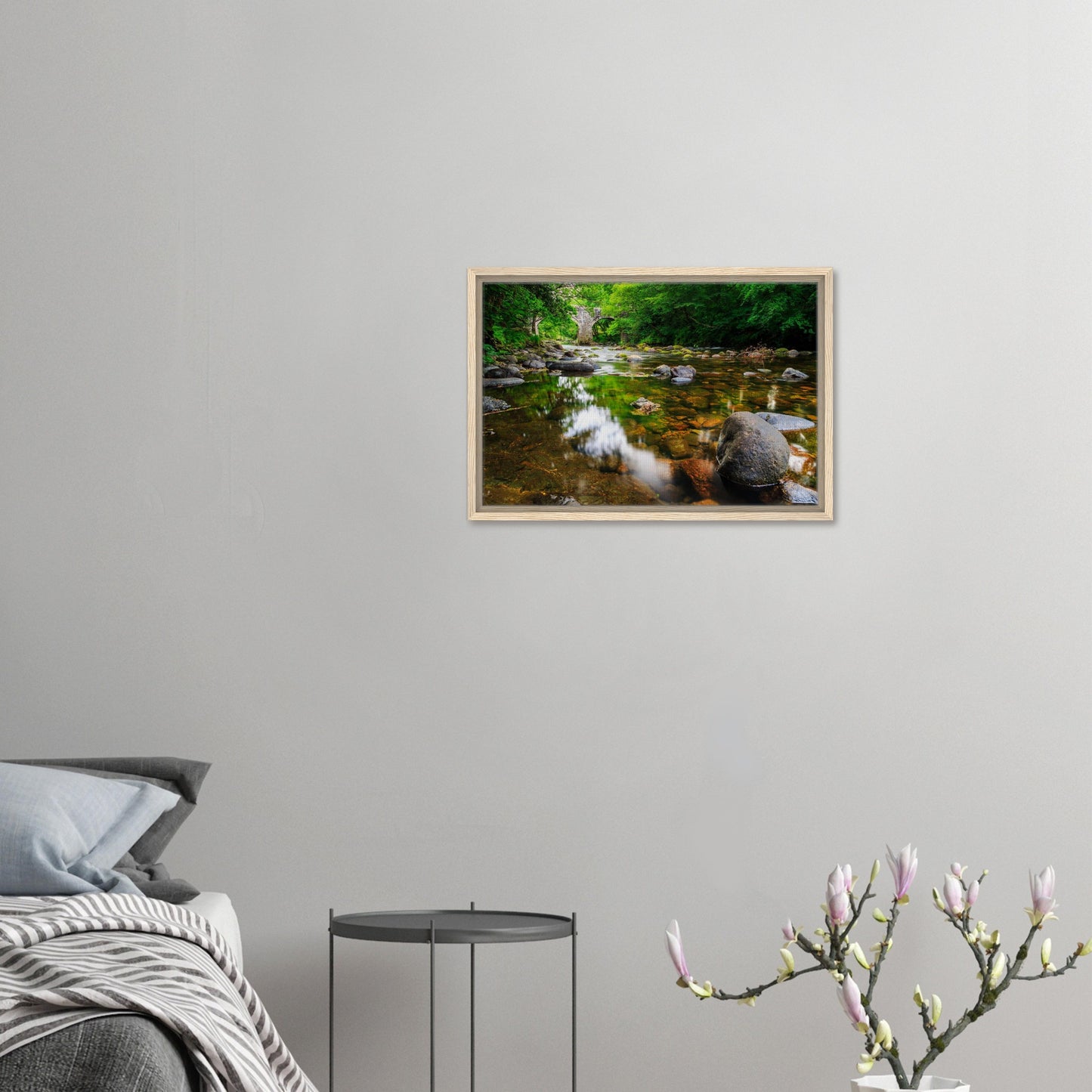 Framed artwork of Newbridge surrounded by lush greenery