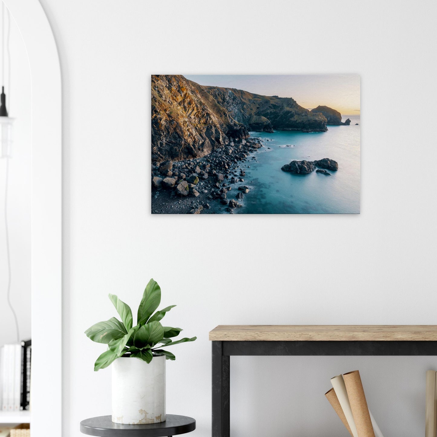 Idyllic golden hour light enveloping Mullion Cove’s cliffs and beach in calm serenity