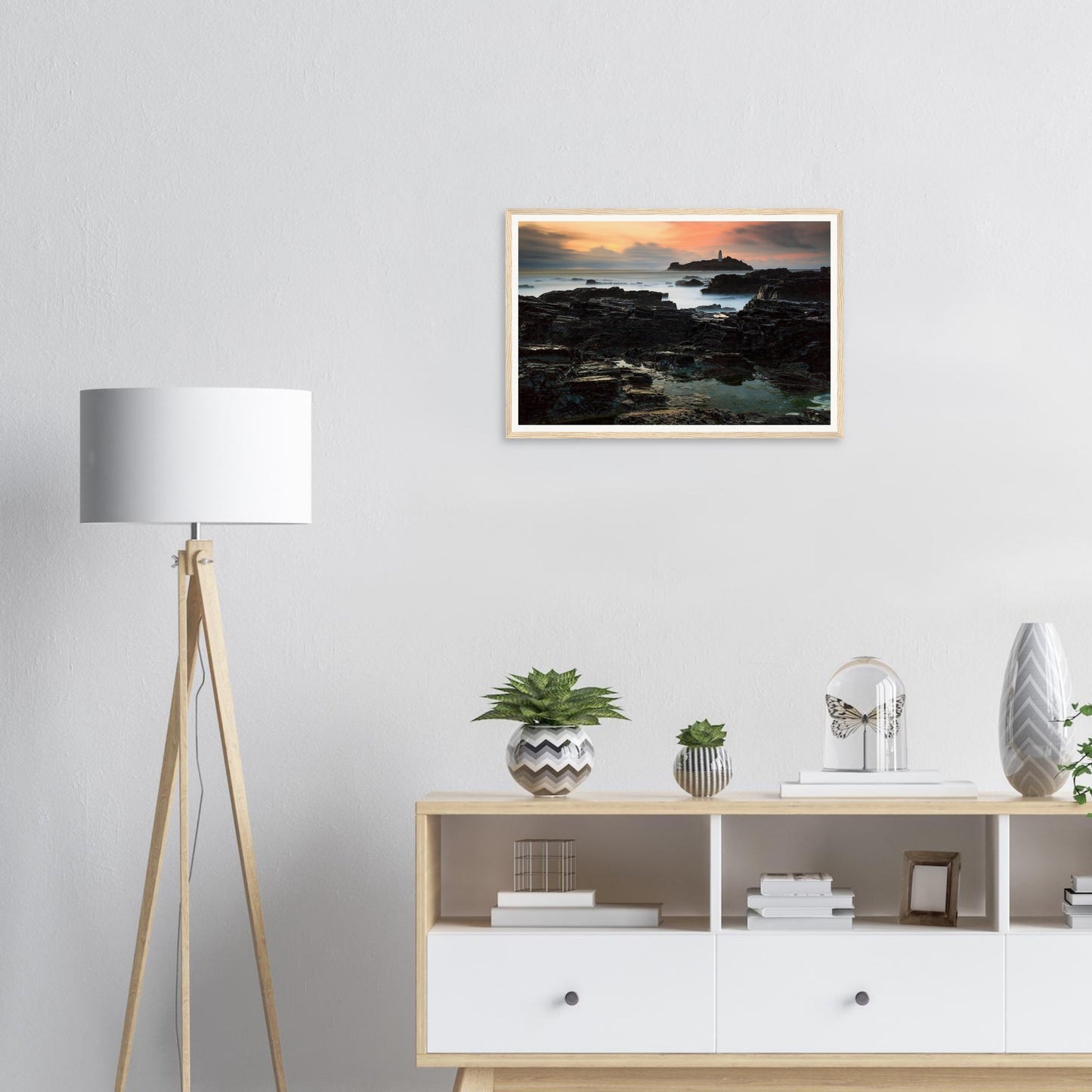 Historic Cornish lighthouse on rocky outcrop framed print