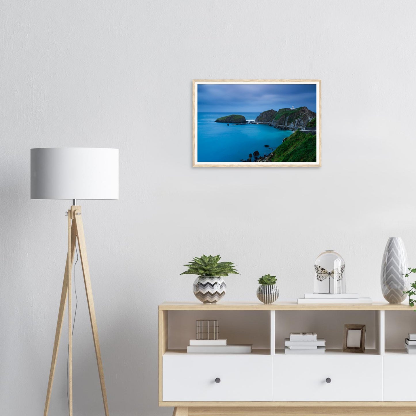 Rugged cliffs of Lundy Island with lighthouse at twilight framed print