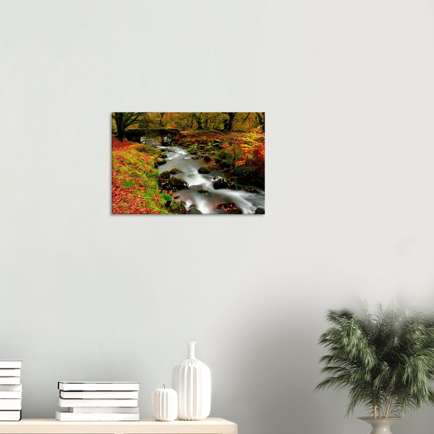 Dartmoor woodland stream in soft focus surrounded by autumn leaves