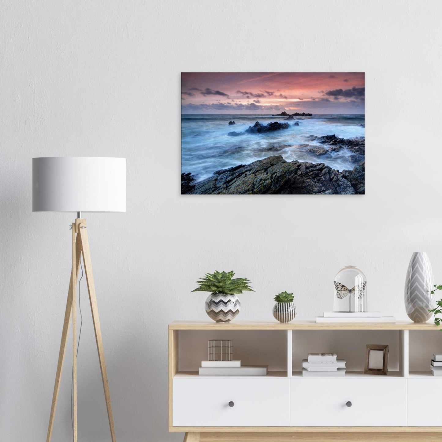 Coastal landscape canvas of Heybrook Bay with motion-filled sea and rugged rocks beneath a vibrant golden hour sky ablaze with fiery colors.