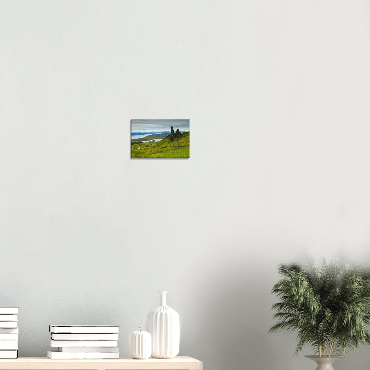 Canvas artwork featuring The Old Man of Storr rising above the Scottish Highlands with lochs and valleys in the distance.
