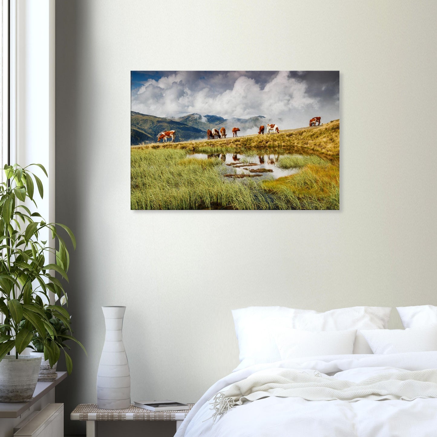 Peaceful alpine canvas print showing a grazing herd near a pond under a sky of drifting clouds and distant rugged peaks.