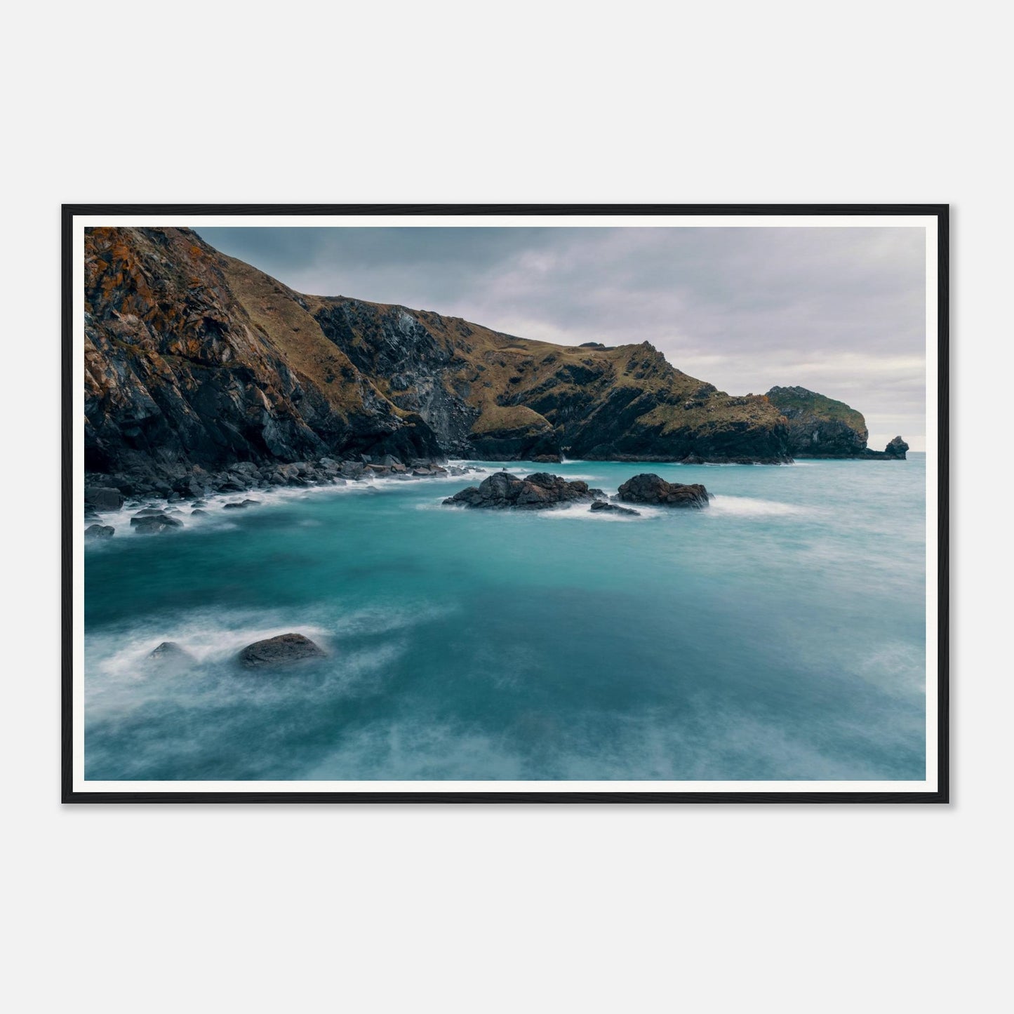 Scenic framed wall art of Mullion Cove turquoise sea and rocks