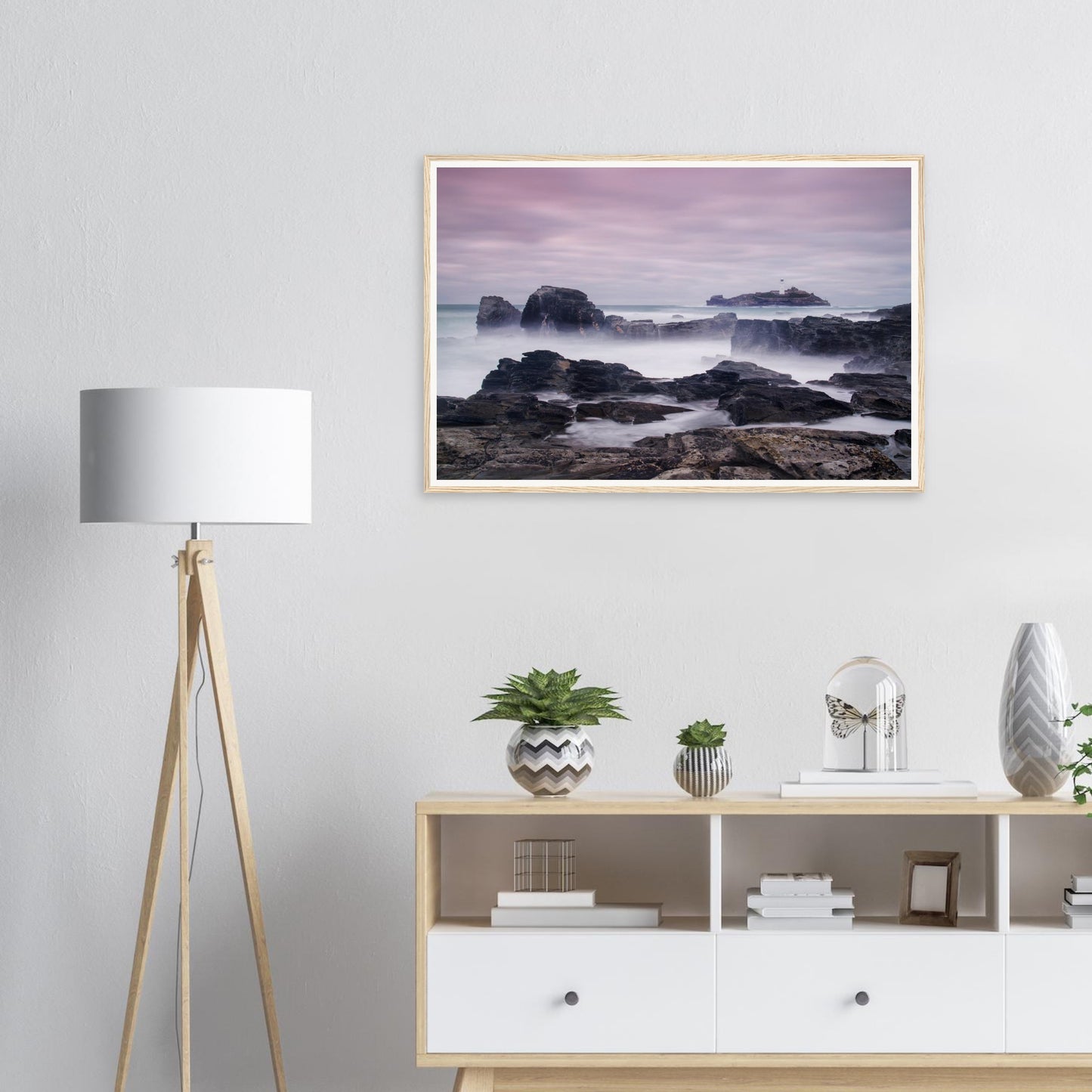 Rugged rocks and soft pastel sky at Godrevy Lighthouse framed print