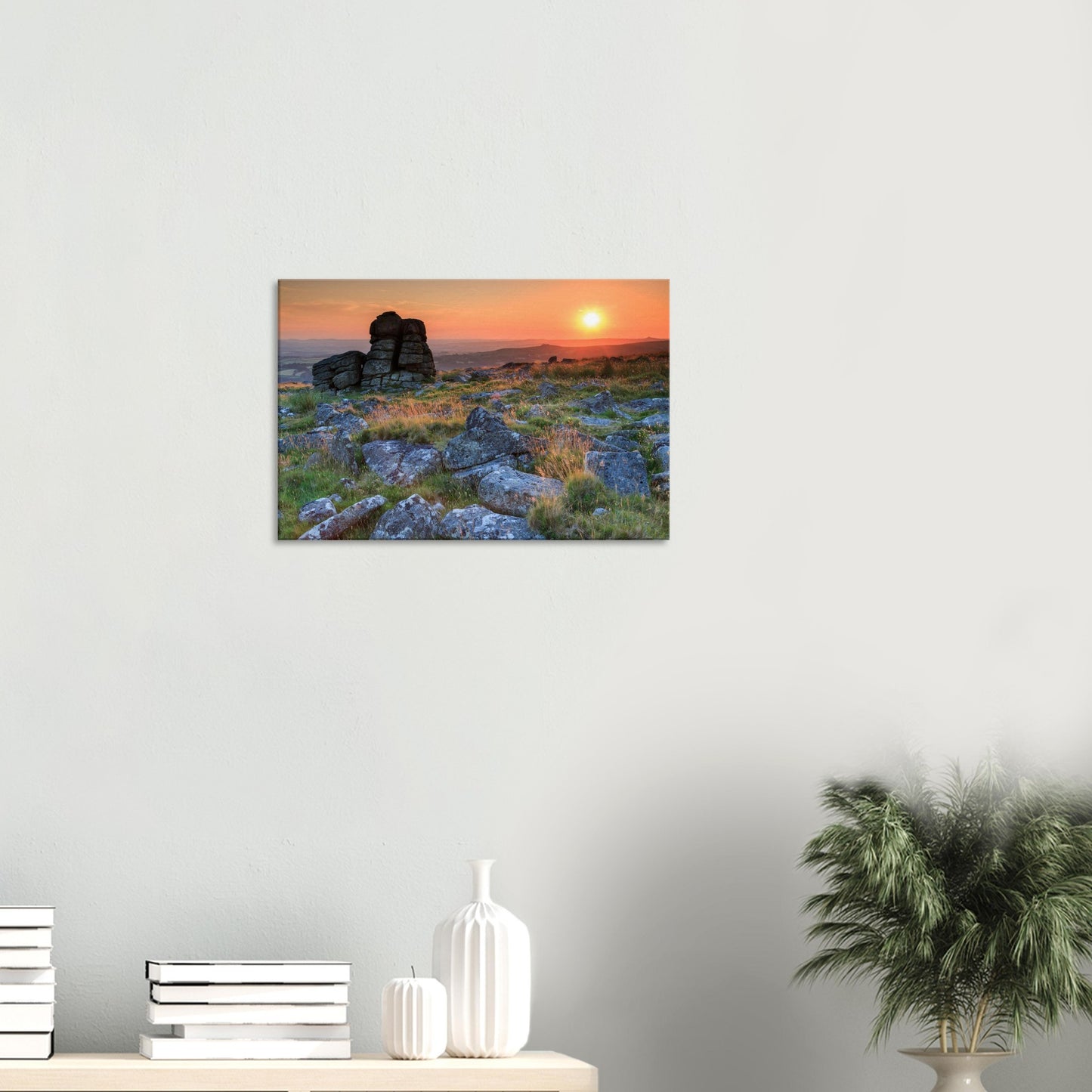 Dramatic Dartmoor sunset showcasing the warm interplay of light and shadow on rocky terrain