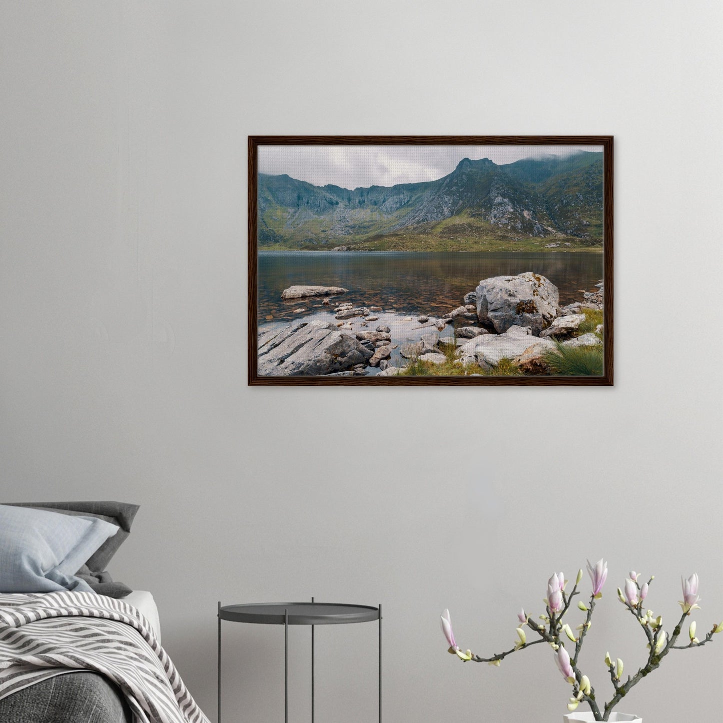 Tranquil lake with rocks and mountains canvas