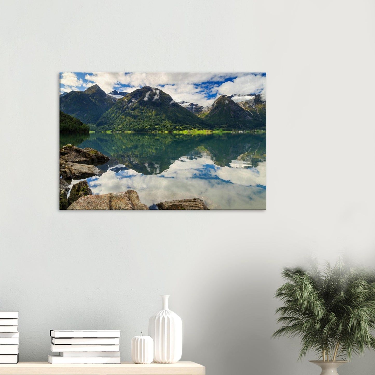 Natural splendour captured in a reflective lake scene, highlighting the contrast of water, rock, and forest