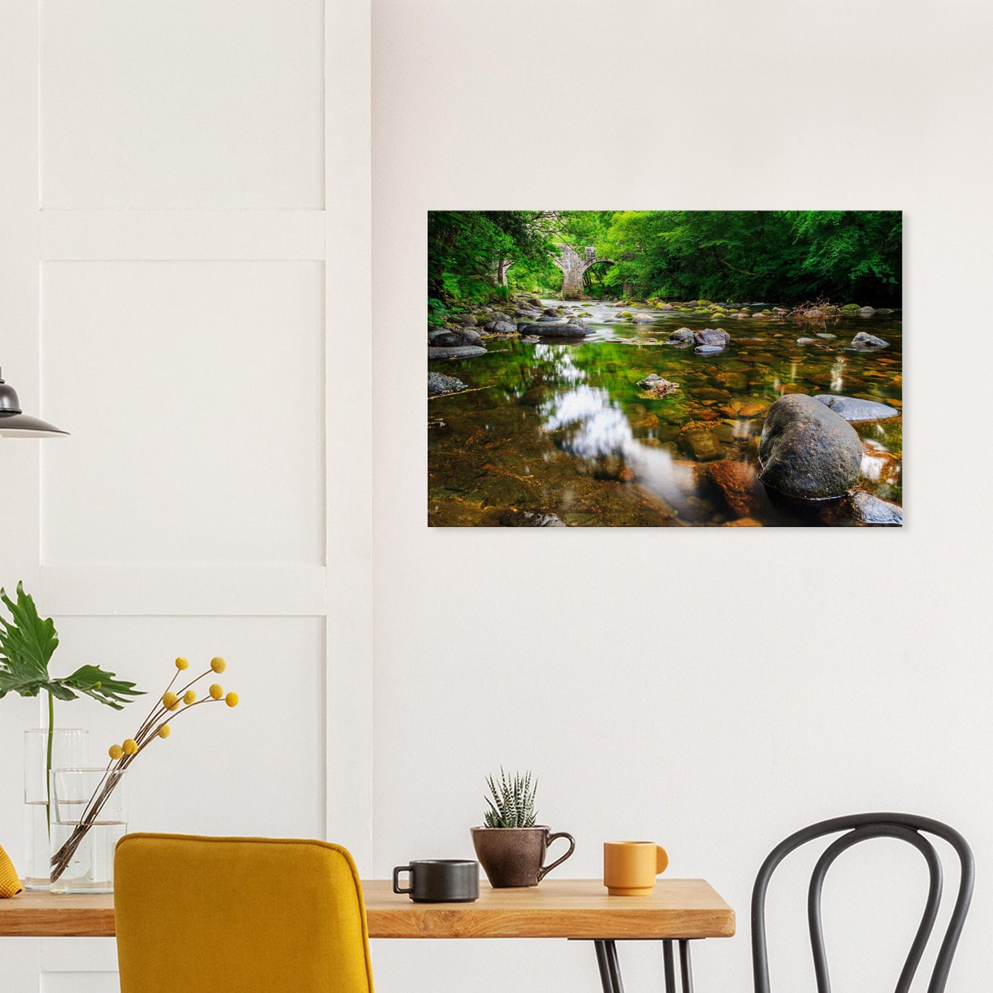 Gentle light illuminating mossy stones and riverbanks under the graceful arches of Newbridge