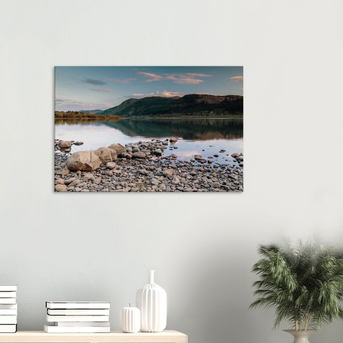 Rocky shoreline of Bassenthwaite Lake leading to serene water reflections