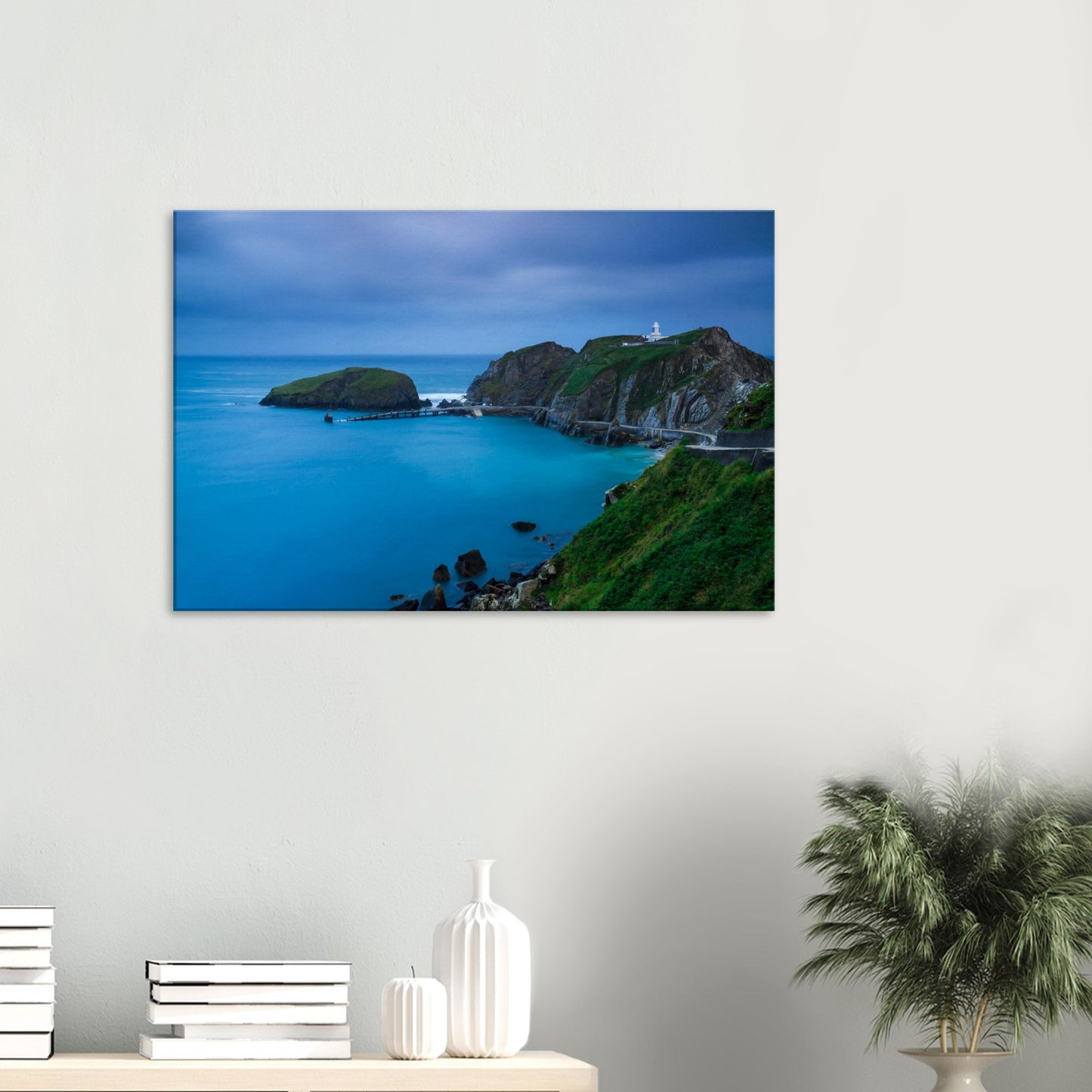 Twilight canvas of Lundy Island’s Landing Bay with a lighthouse beacon, peaceful sea, and a slender pier stretching into the distance.