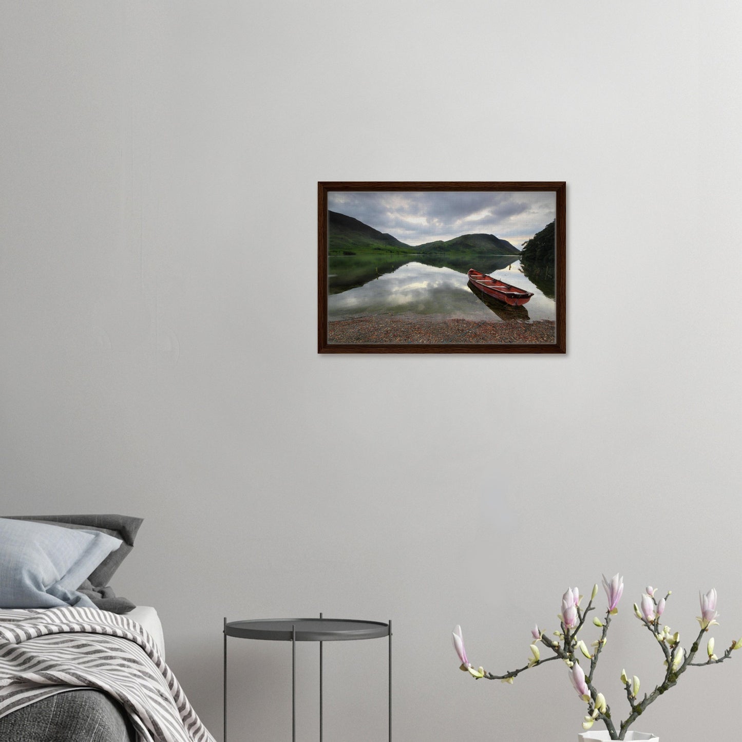 Red boat by Crummock Water in peaceful Lake District scene