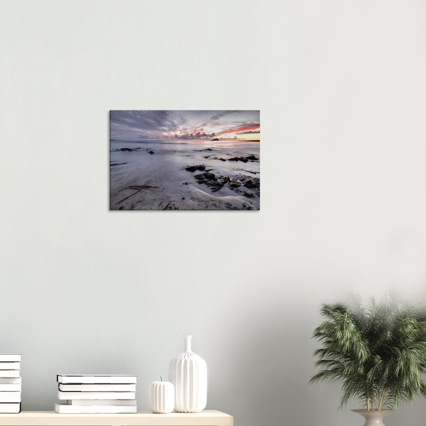 Canvas print capturing Wembury Beach’s dusky elegance with soft sunset colors, scattered rocks, and Mewstone looming in the distance.