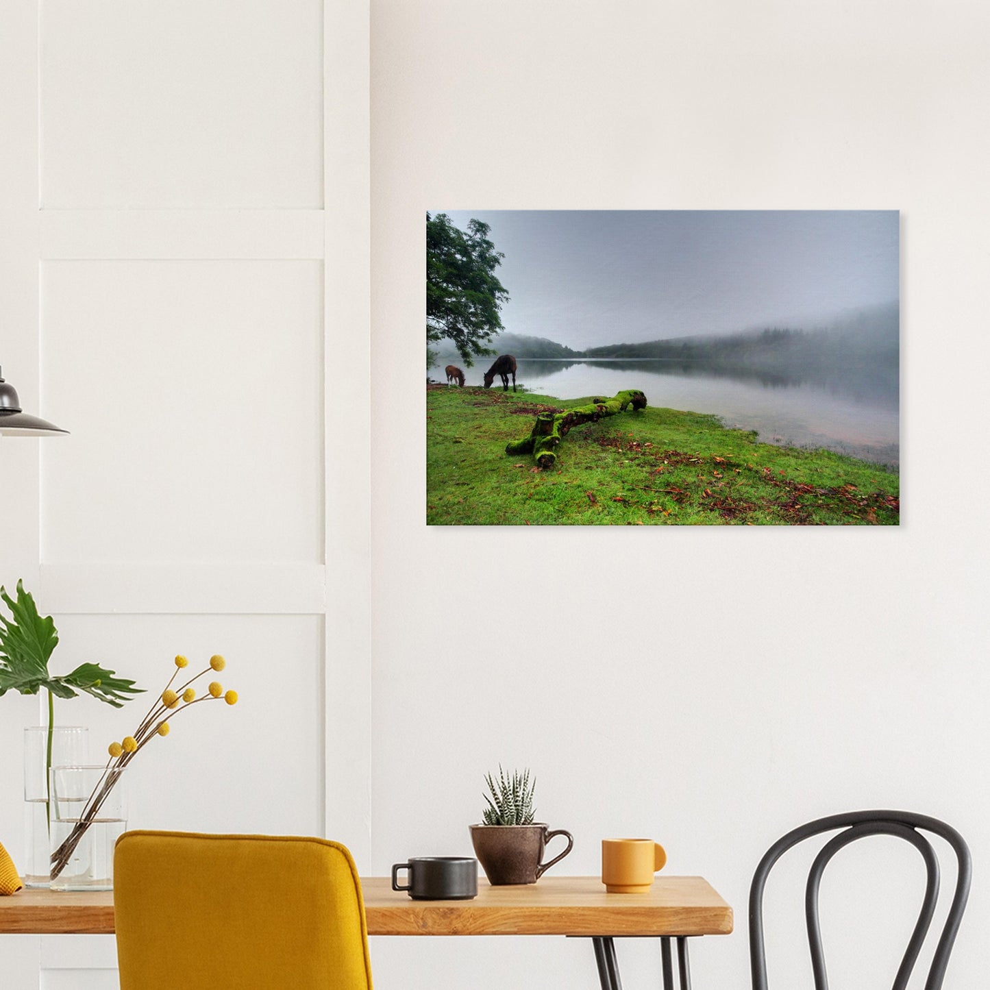 Quiet foggy morning at Burrator Reservoir with grazing wildlife