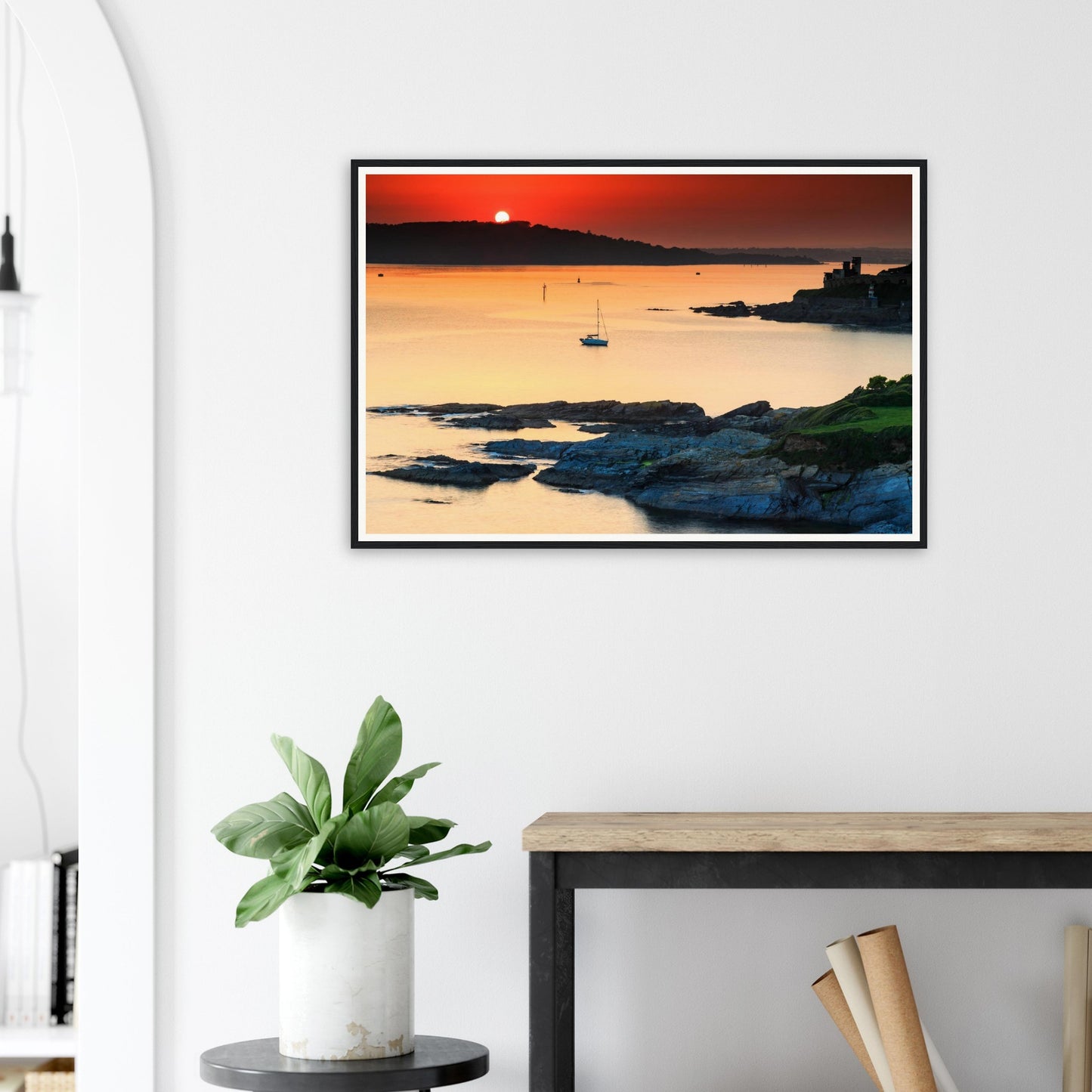 Framed wall art of Plymouth Sound dusk with sailboat and cliffs