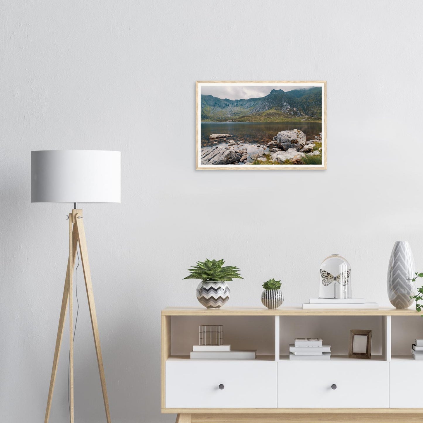 Rocks rising from Llyn Idwal lake framed print Snowdonia