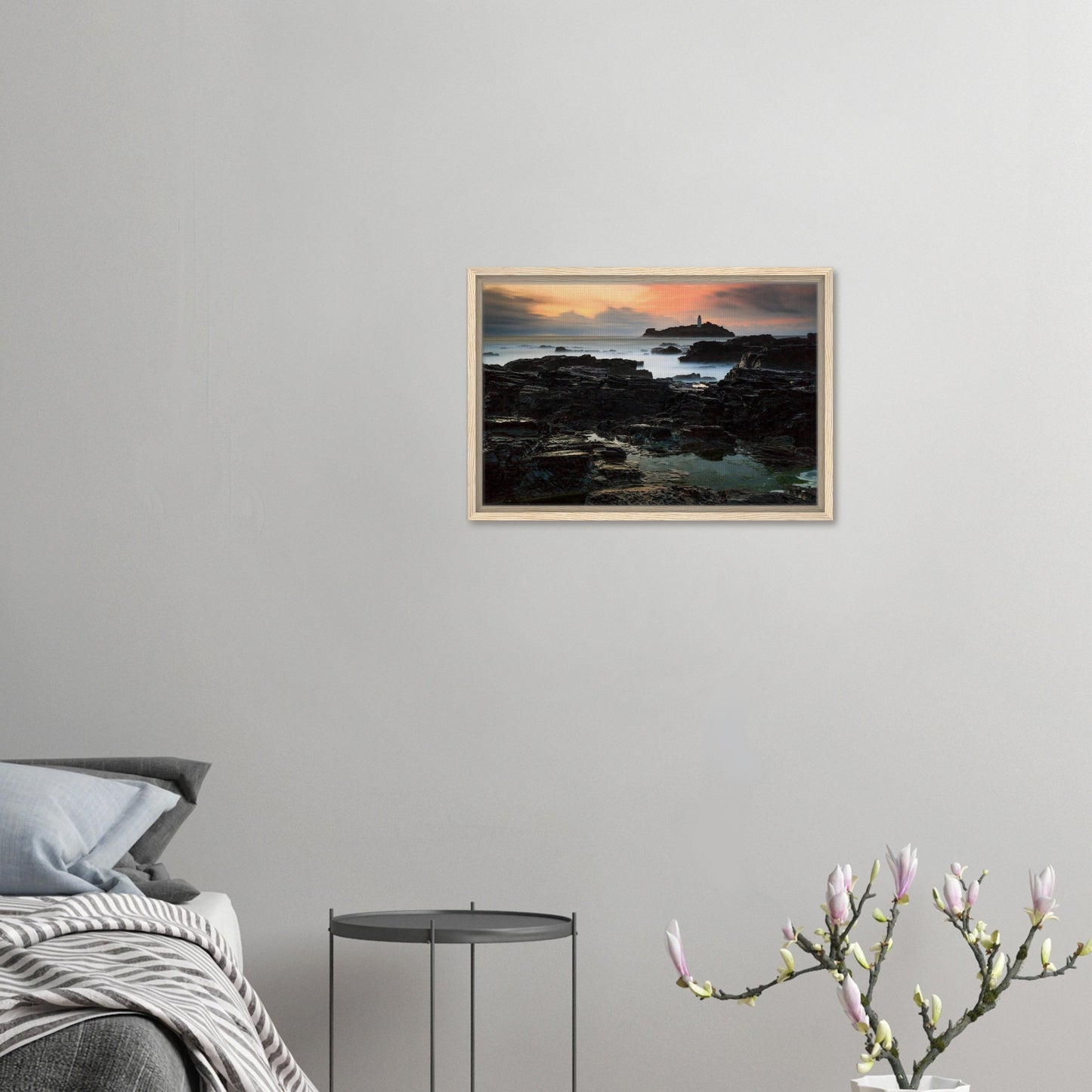 Cornwall lighthouse on rocky outcrop during golden hour canvas