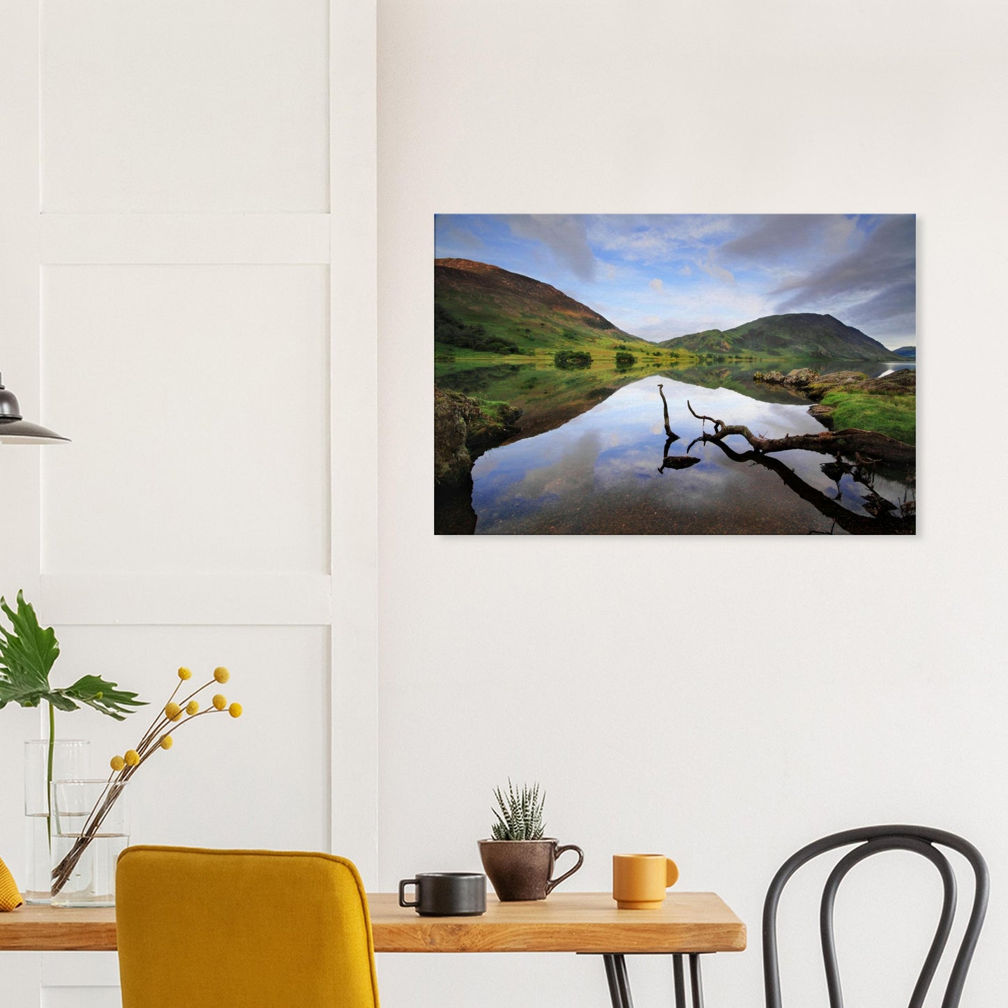 Peaceful landscape canvas of Crummock Water showing a branch floating near the shore and calm waters reflecting the gentle Lake District scenery.