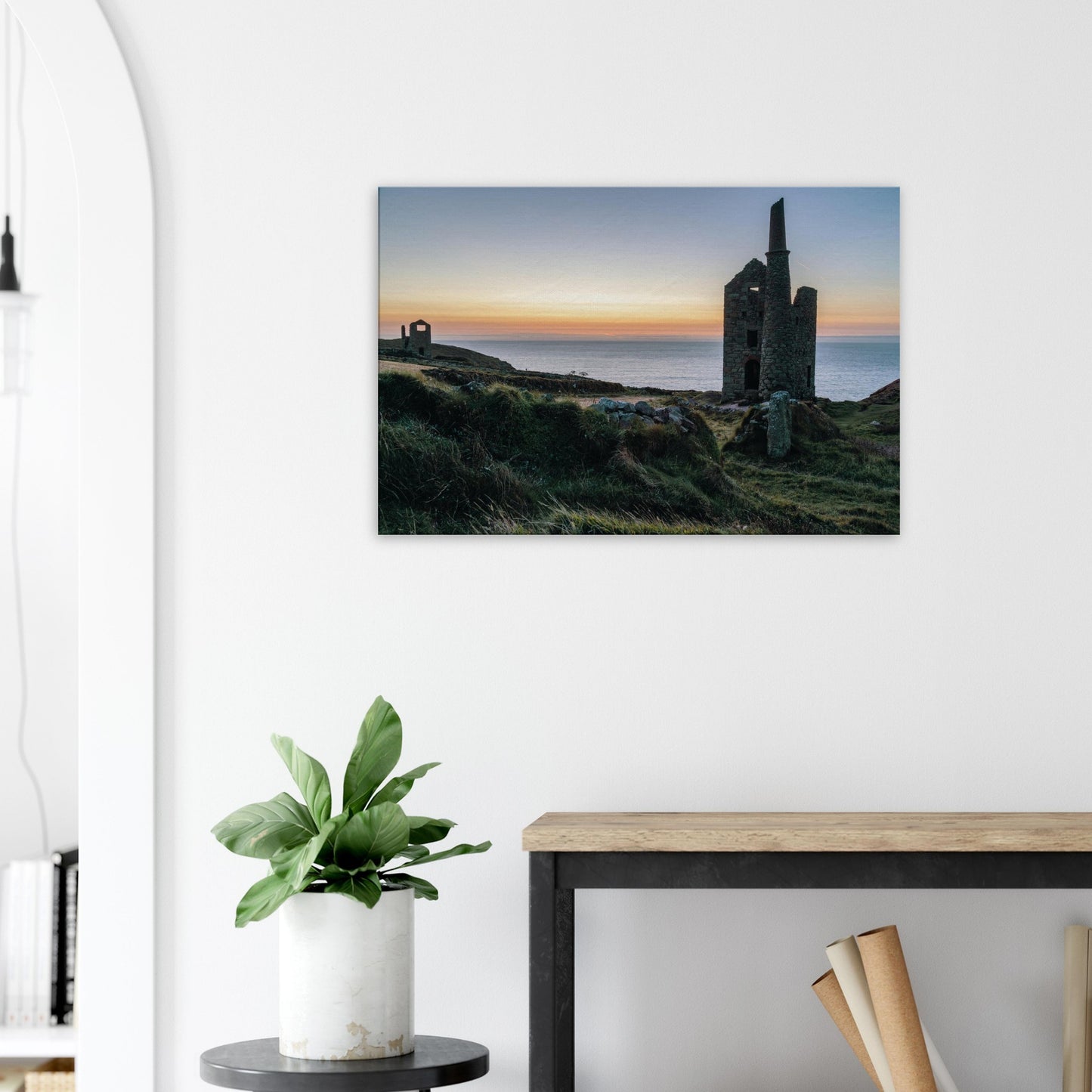 Cornwall’s Wheal Owles framed by the warm amber glow of the setting sun