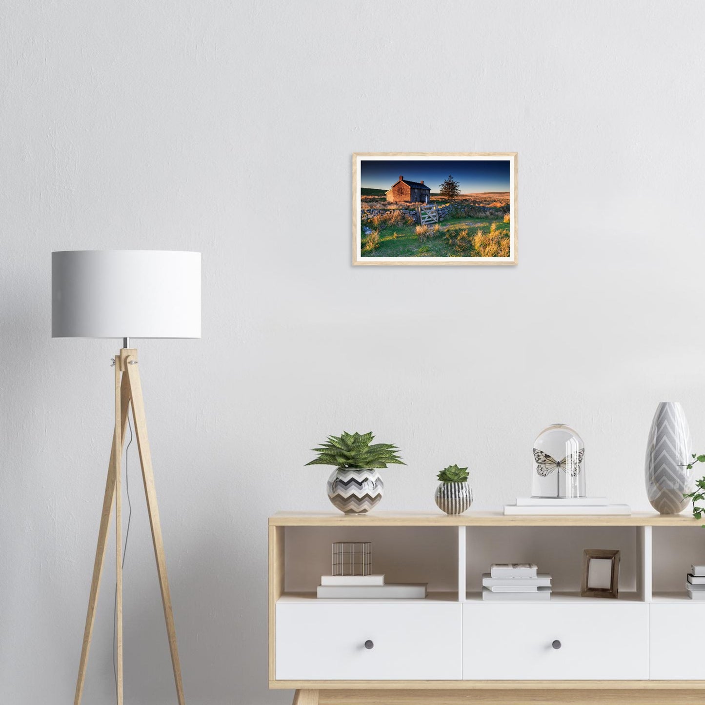 Warm golden sunrise over moorland and farmstead framed wall art