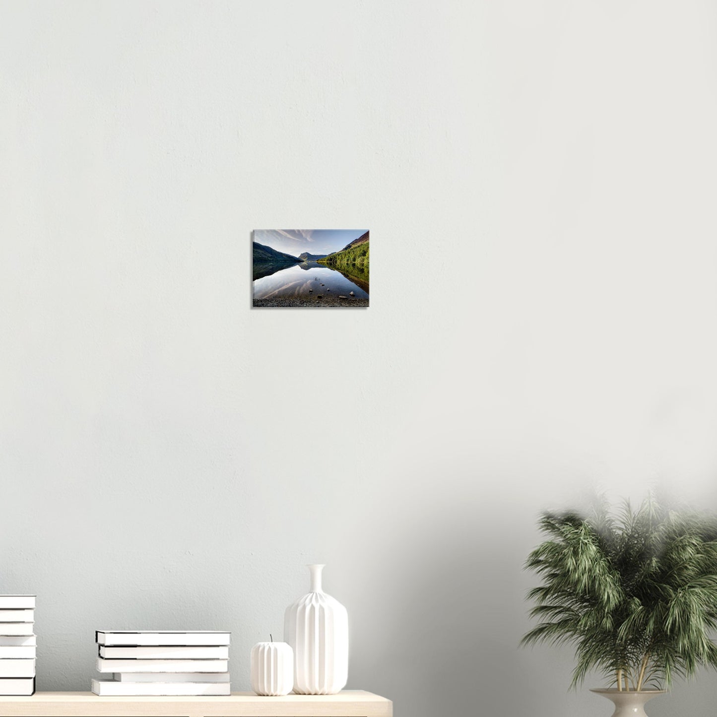 Canvas print of Buttermere Lake’s morning calm, featuring mirrored reflections of the surrounding fells lit by flecks of sunlight.