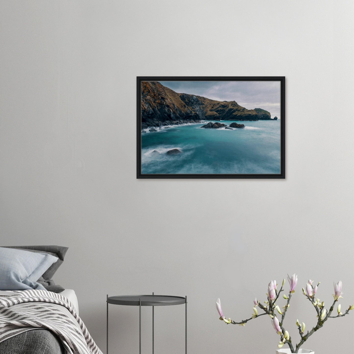 Turquoise sea and dark rocks canvas art