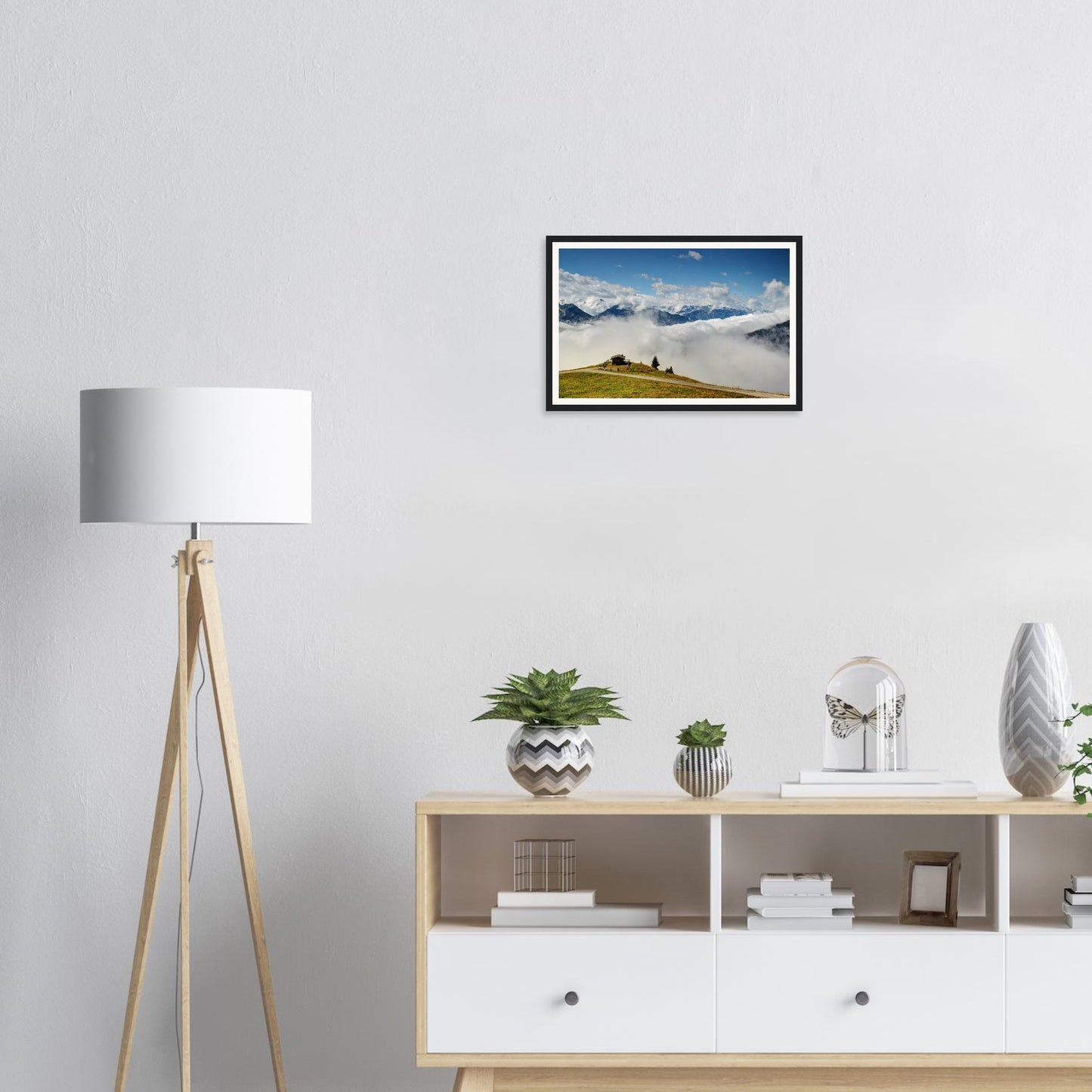 Verdant hilltop framed print in Austrian Alps above the clouds